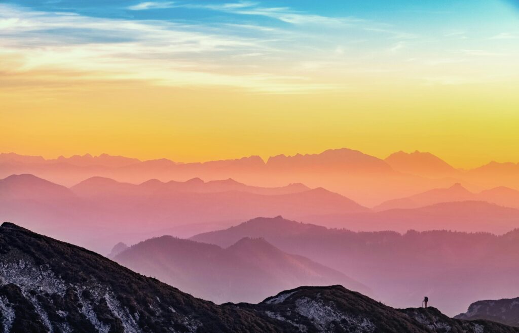 a photo of mountain sky taken at sunset