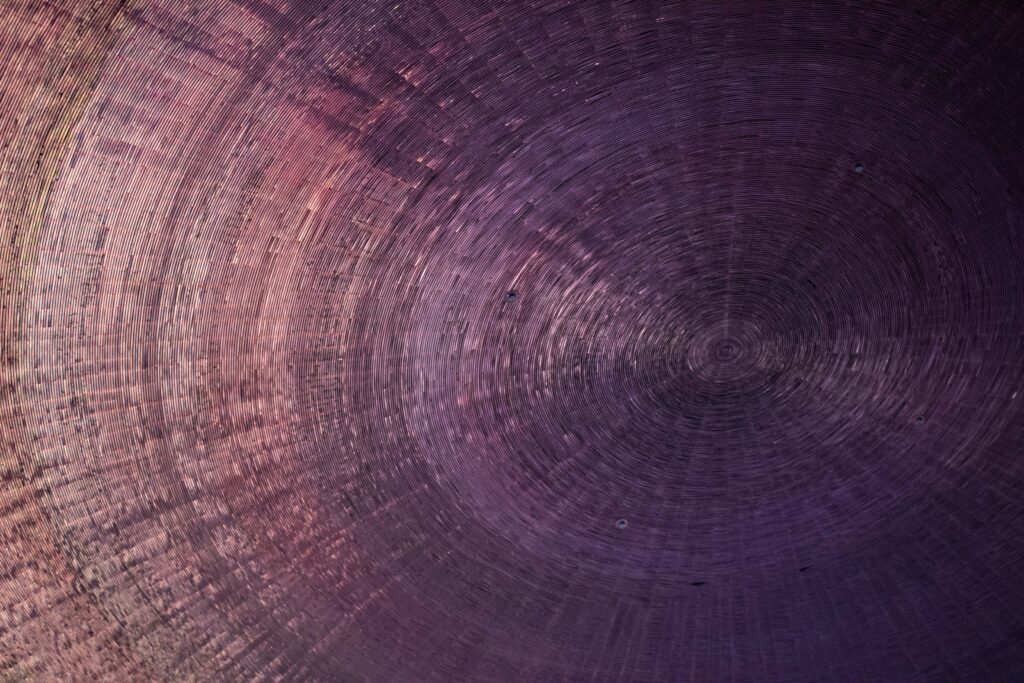 Intricate abstract spiral pattern with a gradient effect creating depth and texture.